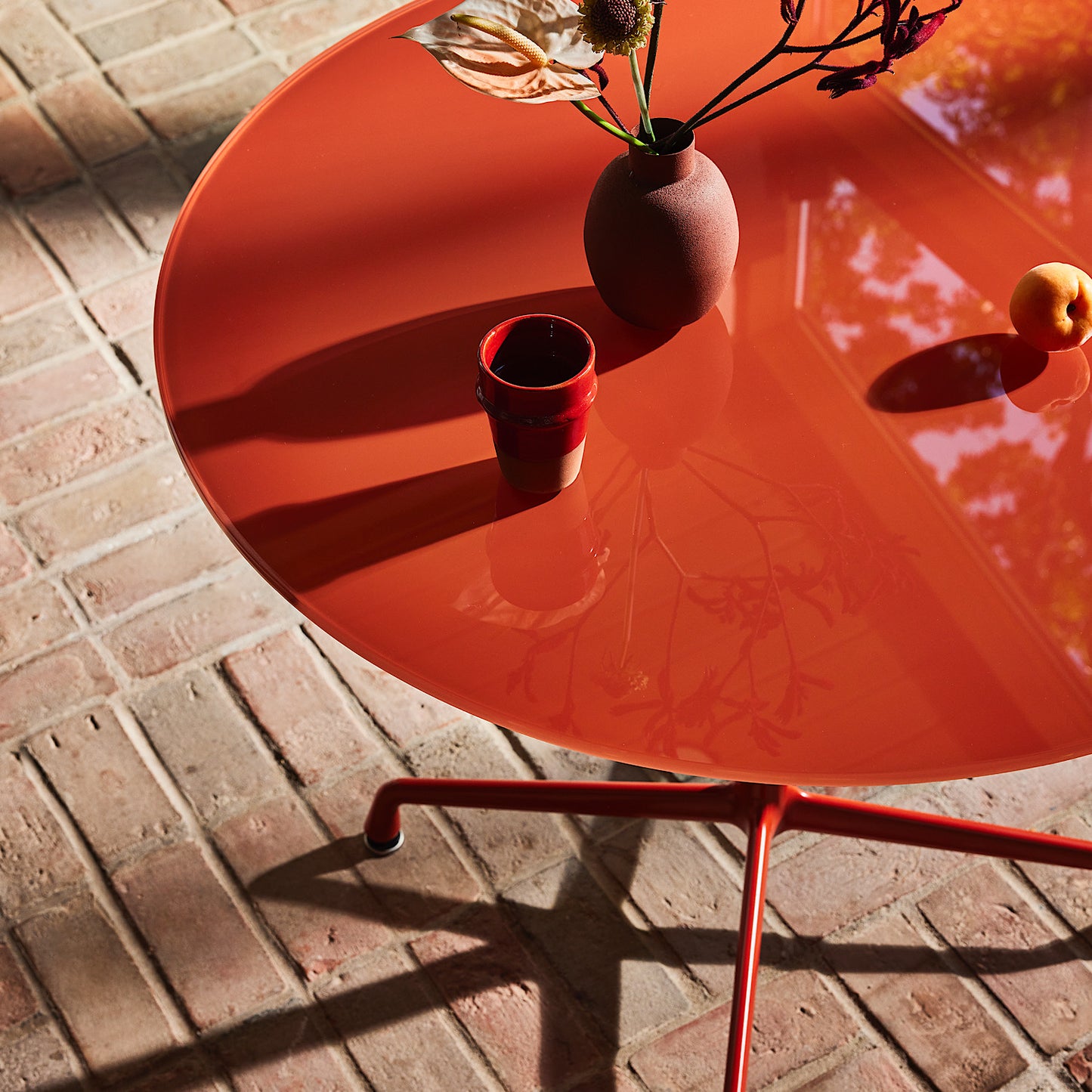 Herman Miller x HAY Eames Universal Base Round Table in Iron Red